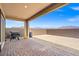 Covered patio features brick pavers, a grill, and mountain views at 10186 Zeta Tucana St, Las Vegas, NV 89143