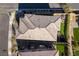 An aerial view of a roof, yard, and patio in a suburban neighborhood on a sunny day at 12381 Liberty Beacon Ave, Las Vegas, NV 89138