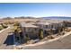 An aerial view of the neighborhood showcasing the well-maintained homes and mountain views at 12381 Liberty Beacon Ave, Las Vegas, NV 89138