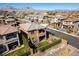 An aerial view highlighting the home, backyard with artificial grass, and surrounding mountain views at 12381 Liberty Beacon Ave, Las Vegas, NV 89138