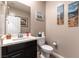 Modern powder room with black vanity and updated sink at 12381 Liberty Beacon Ave, Las Vegas, NV 89138