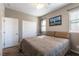 Comfortable bedroom with carpeted floors, ceiling fan, and natural lighting at 12381 Liberty Beacon Ave, Las Vegas, NV 89138
