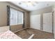 Charming bedroom with plush carpet, and natural light from the window at 12381 Liberty Beacon Ave, Las Vegas, NV 89138