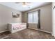 Cozy bedroom with daybed, plush carpet, and natural light from the window at 12381 Liberty Beacon Ave, Las Vegas, NV 89138