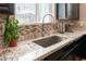 Granite countertops with tile backsplash at 12381 Liberty Beacon Ave, Las Vegas, NV 89138