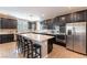 Well-equipped kitchen featuring stainless steel appliances, granite countertops, and a functional center island at 12381 Liberty Beacon Ave, Las Vegas, NV 89138
