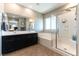 Modern main bathroom with dual sink vanity, separate shower and tub at 12381 Liberty Beacon Ave, Las Vegas, NV 89138