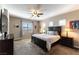 Spacious main bedroom with large bed and ceiling fan at 12381 Liberty Beacon Ave, Las Vegas, NV 89138
