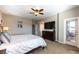 Bright bedroom with balcony access, TV, ceiling fan and plush carpeting at 12381 Liberty Beacon Ave, Las Vegas, NV 89138
