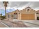 Beautiful single-story house with a two-car garage and decorative brick driveway at 1311 Watercreek Dr, North Las Vegas, NV 89032