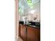 Close-up of a cabinet with a mirrored backsplash and decorative lighting, enhancing the room's design at 145 E Harmon Ave # 2007, Las Vegas, NV 89109