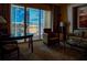 Suite living area with a table and seating, with city views outside the large window at 145 E Harmon Ave # 2007, Las Vegas, NV 89109