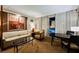 Cozy living room featuring a plush sofa, armchair, coffee table and a view of the city skyline at 145 E Harmon Ave # 2007, Las Vegas, NV 89109