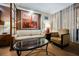 Inviting living room featuring a sofa, chair, table with an art display, and city views beyond at 145 E Harmon Ave # 2007, Las Vegas, NV 89109