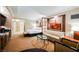 Open-concept suite with a full living area, kitchenette, separate bedroom, and bathroom at 145 E Harmon Ave # 2007, Las Vegas, NV 89109