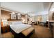 This bright, spacious main bedroom offers a serene setting with a plush bed and seating area at 145 E Harmon Ave # 2007, Las Vegas, NV 89109