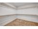 Spacious walk-in closet with carpeted floors, white walls, and shelving at 1485 Sound Ln, North Las Vegas, NV 89031