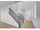 Inviting foyer with a staircase and tile flooring leading to the front door at 1485 Sound Ln, North Las Vegas, NV 89031