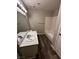 Bathroom with hardwood floors, a bath tub and a large mirror at 1639 Justin Cir # 1639, Henderson, NV 89011