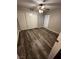 Bedroom with wood look floors, ceiling fan, and a large closet at 1639 Justin Cir # 1639, Henderson, NV 89011