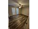 Bedroom features natural light, wood look floors, and a ceiling fan at 1639 Justin Cir # 1639, Henderson, NV 89011