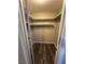 A well-organized walk-in closet with shelves and wood-look floors at 1639 Justin Cir # 1639, Henderson, NV 89011