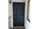A dark painted front door with the house numbers in a gold paint at 1639 Justin Cir # 1639, Henderson, NV 89011