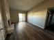 Spacious living room with hardwood floors, a stone fireplace and sliding door access to the outside at 1639 Justin Cir # 1639, Henderson, NV 89011