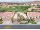 Stunning aerial view of a well-manicured property with a golf course backdrop, showcasing the home's prime location at 181 Cliff Valley Dr, Las Vegas, NV 89148