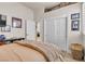 Cozy bedroom featuring a closet, interior door, and shelf with decorative train models at 181 Cliff Valley Dr, Las Vegas, NV 89148