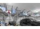 This garage features custom overhead storage racks and an automatic door opener at 181 Cliff Valley Dr, Las Vegas, NV 89148