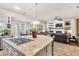 Open kitchen layout with a granite island, stainless steel appliances, and seamlessly connected living spaces at 181 Cliff Valley Dr, Las Vegas, NV 89148