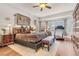 Spacious main bedroom featuring hardwood floors, large windows, and a cozy sitting area at 181 Cliff Valley Dr, Las Vegas, NV 89148