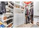 Organized walk-in closet with custom shelving, drawers, and ample storage space for clothing and shoes at 181 Cliff Valley Dr, Las Vegas, NV 89148