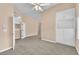 Spacious bonus room with neutral walls and carpet flooring with built-in cabinets at 1923 Grey Eagle St, Henderson, NV 89074