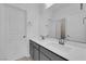 Bathroom featuring double sinks, quartz countertops, and framed mirrors at 227 Badwater Basin St, Las Vegas, NV 89138