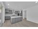 Contemporary kitchen features grey cabinets, a center island, and stainless steel appliances at 227 Badwater Basin St, Las Vegas, NV 89138