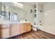 Bathroom featuring a shower-tub combo, spacious vanity, and wood-look floors at 2325 Windmill Pkwy # 1313, Henderson, NV 89074