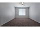 Bedroom featuring neutral walls, carpet floors, and bright window at 2325 Windmill Pkwy # 1313, Henderson, NV 89074
