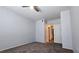 Bedroom featuring neutral walls, carpet floors, ceiling fan, and ensuite bathroom access at 2325 Windmill Pkwy # 1313, Henderson, NV 89074