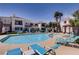 Inviting community pool with lounge chairs and a well-maintained surrounding area, perfect for relaxation and recreation at 2325 Windmill Pkwy # 1313, Henderson, NV 89074