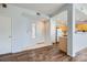 Inviting foyer showcasing beautiful wood floors, neutral paint, and an open floor plan leading into the kitchen at 2325 Windmill Pkwy # 1313, Henderson, NV 89074