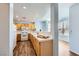 Well-lit kitchen with wood cabinets, white countertops, and modern appliances at 2325 Windmill Pkwy # 1313, Henderson, NV 89074