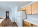 Kitchen with wooden cabinets and modern appliances at 2325 Windmill Pkwy # 1313, Henderson, NV 89074