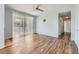 Bright and airy living room featuring wood floors, large window, and neutral paint, perfect for relaxation at 2325 Windmill Pkwy # 1313, Henderson, NV 89074