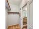 Spacious walk-in closet leading to a shower with stone flooring, creating a functional and organized space at 2325 Windmill Pkwy # 1313, Henderson, NV 89074