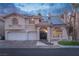 Charming two-story home with a three-car garage, tile roof, and well-maintained landscaping at 2528 Furnace Creek Ave, Henderson, NV 89074