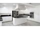 Modern kitchen with white cabinets, a spacious island, and stainless steel appliances, ideal for entertaining at 2528 Furnace Creek Ave, Henderson, NV 89074