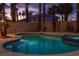 Backyard pool and spa offer a relaxing outdoor living space with mature landscaping at 2528 Furnace Creek Ave, Henderson, NV 89074