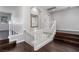 A staircase with white banisters and wood floors with a view to an upstairs area at 2528 Furnace Creek Ave, Henderson, NV 89074